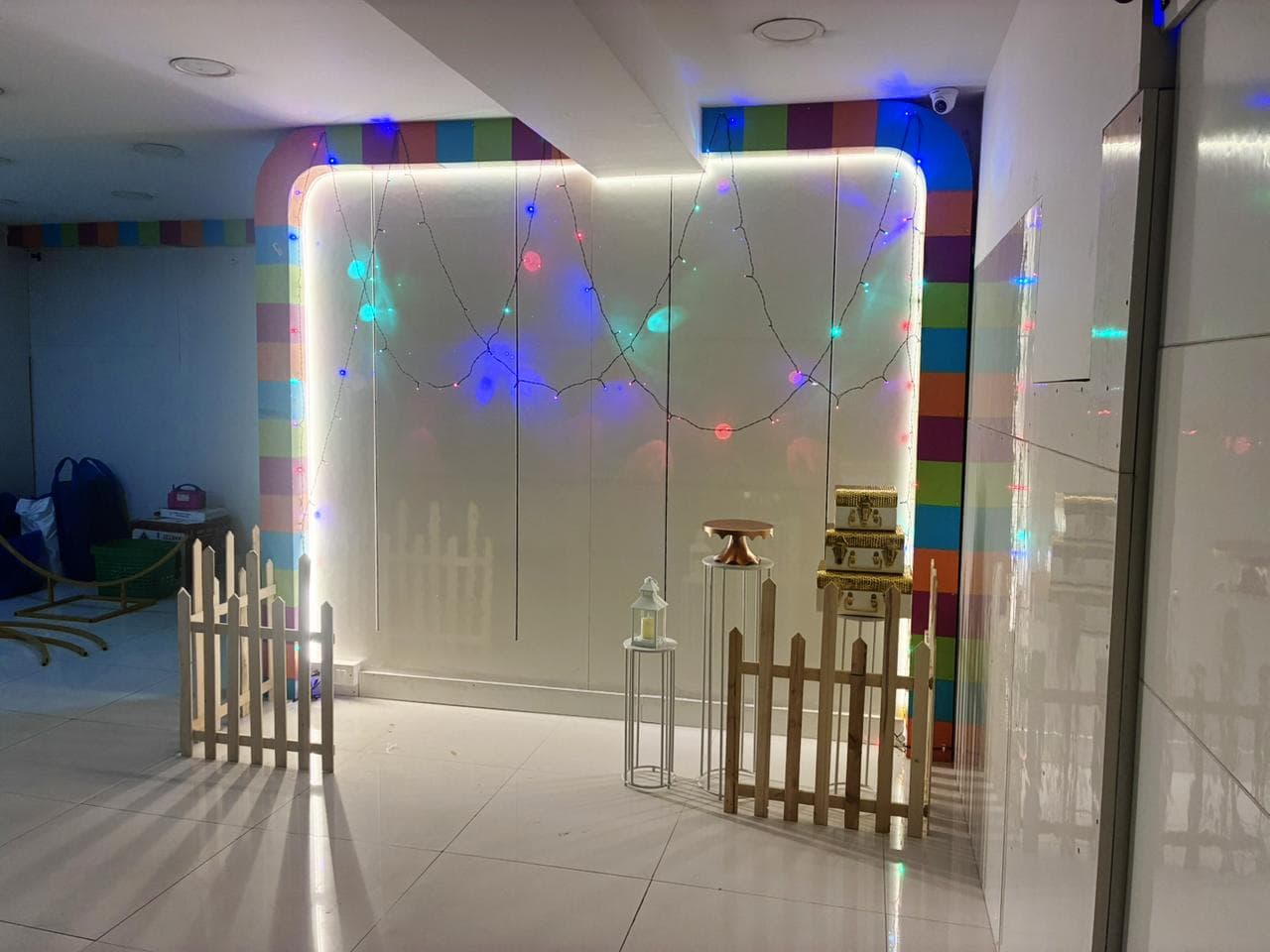 Fairy lights backdrop with picket fencing
