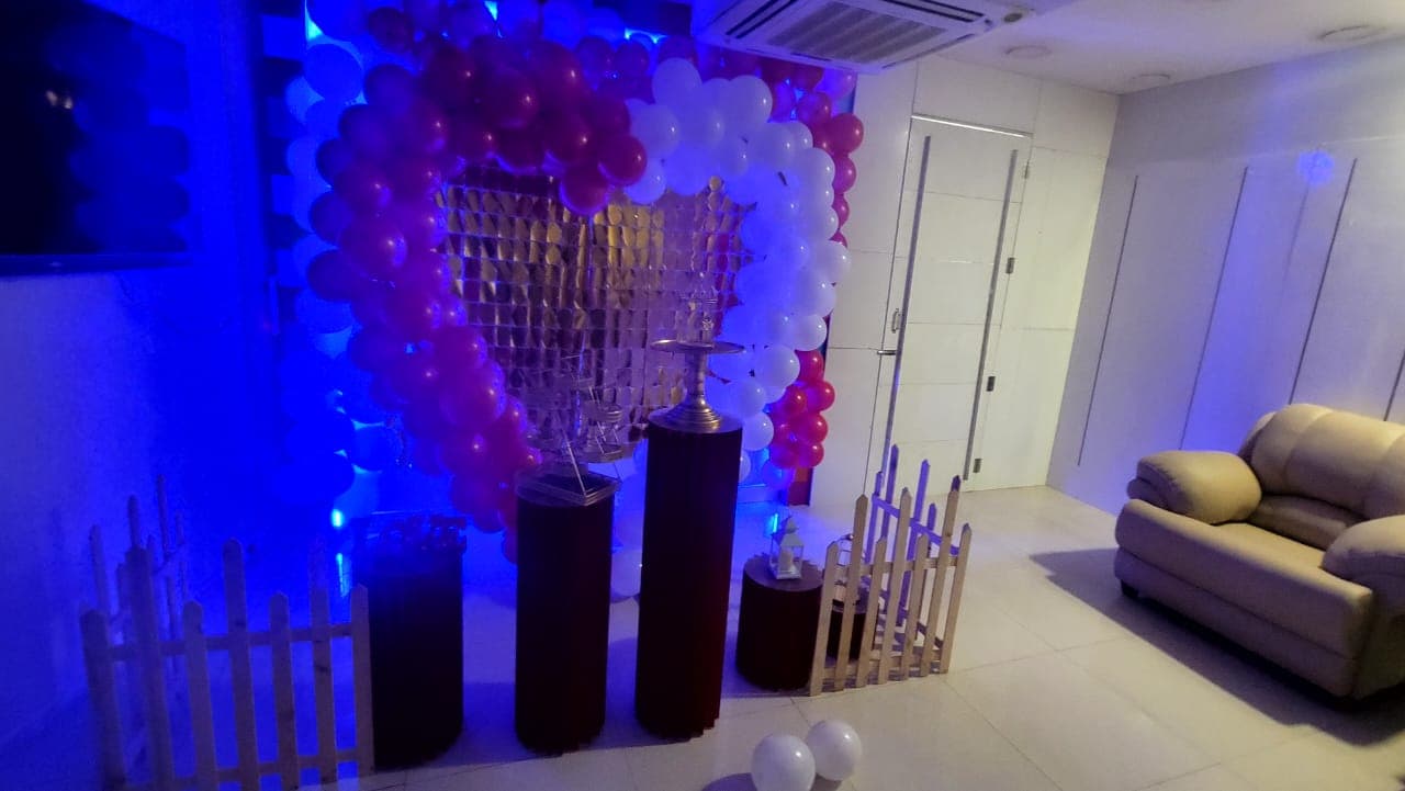 Heart balloon arch glowing with blue LED mood lighting